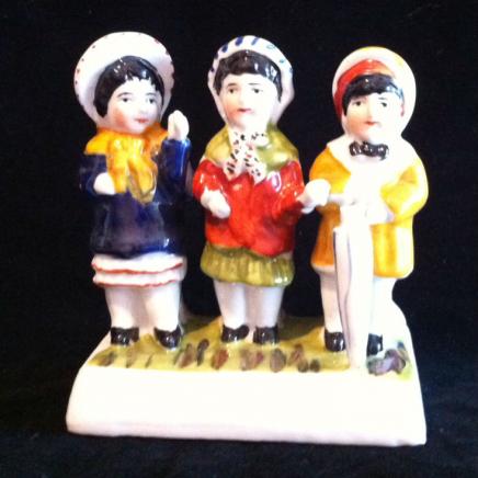Porcelain Figurine Displaying Three Little Ladies